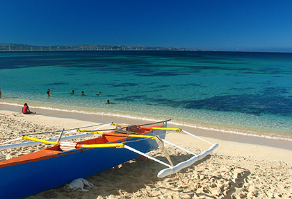 blue outrigger boat docked at Saud Beach, Pagudpud